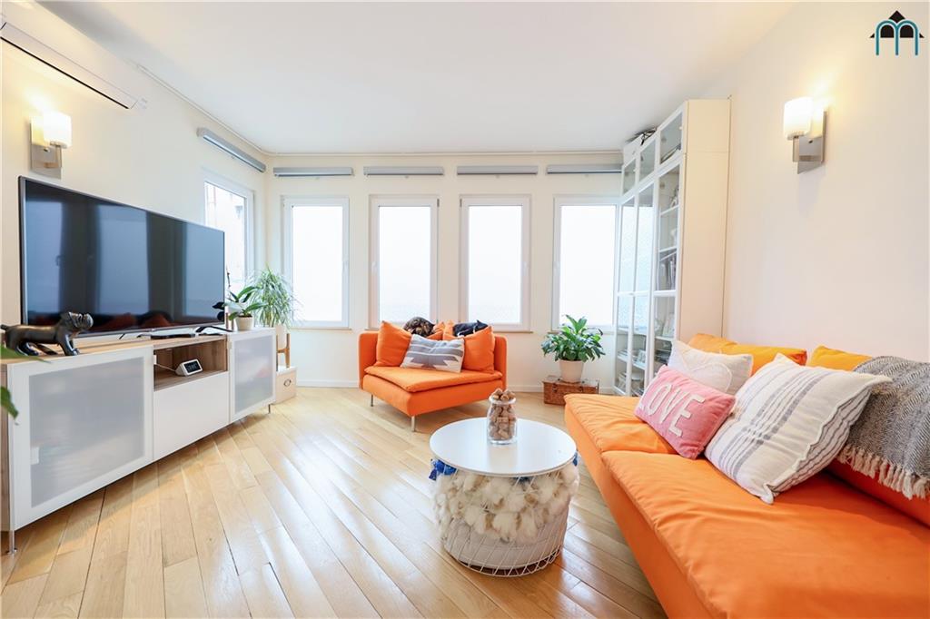 2 Brighton 4th Road Brooklyn, NY 11235 - Photo 1 of 31 a living room with furniture and a flat screen tv