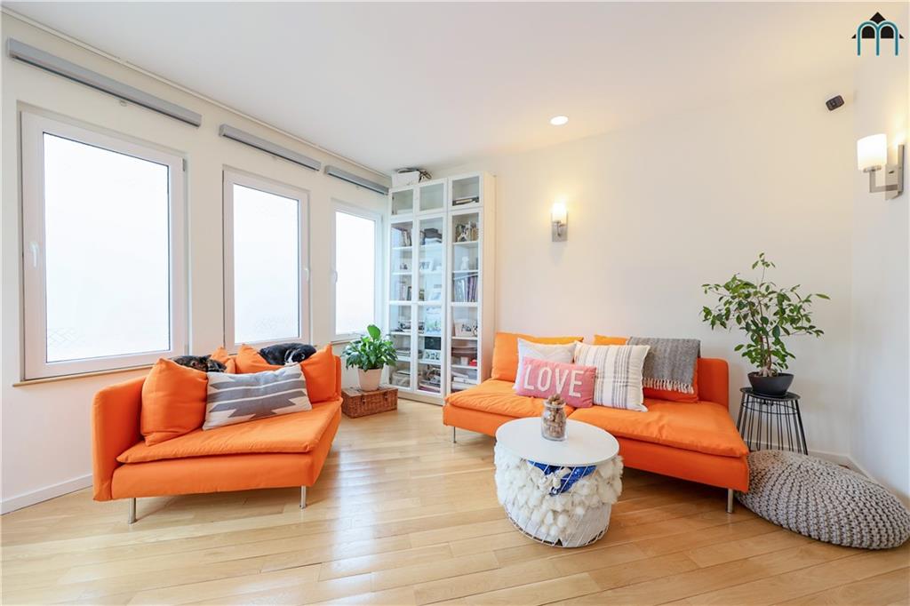 2 Brighton 4th Road Brooklyn, NY 11235 - Photo 2 of 31 a living room with furniture and a large window