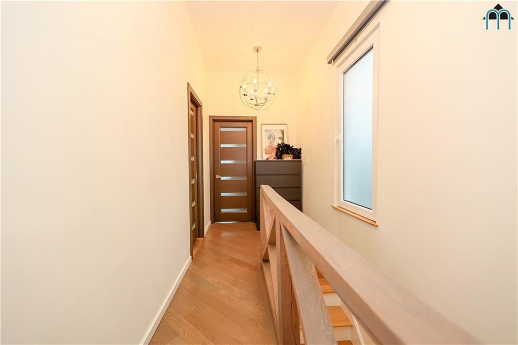 2 Brighton 4th Road Brooklyn, NY 11235 - Photo 13 of 31 a view of a hallway with wooden floor and staircase