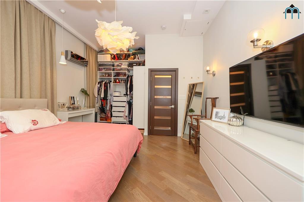 2 Brighton 4th Road Brooklyn, NY 11235 - Photo 14 of 31 a spacious bedroom with a bed and a dresser