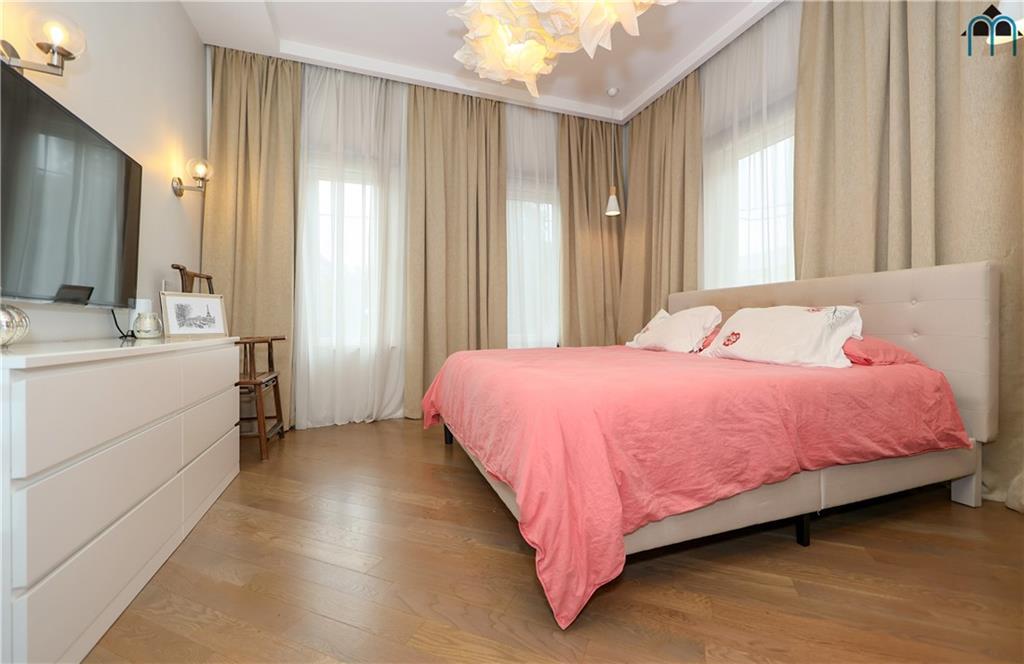 2 Brighton 4th Road Brooklyn, NY 11235 - Photo 15 of 31 a bedroom with a bed dresser and a window