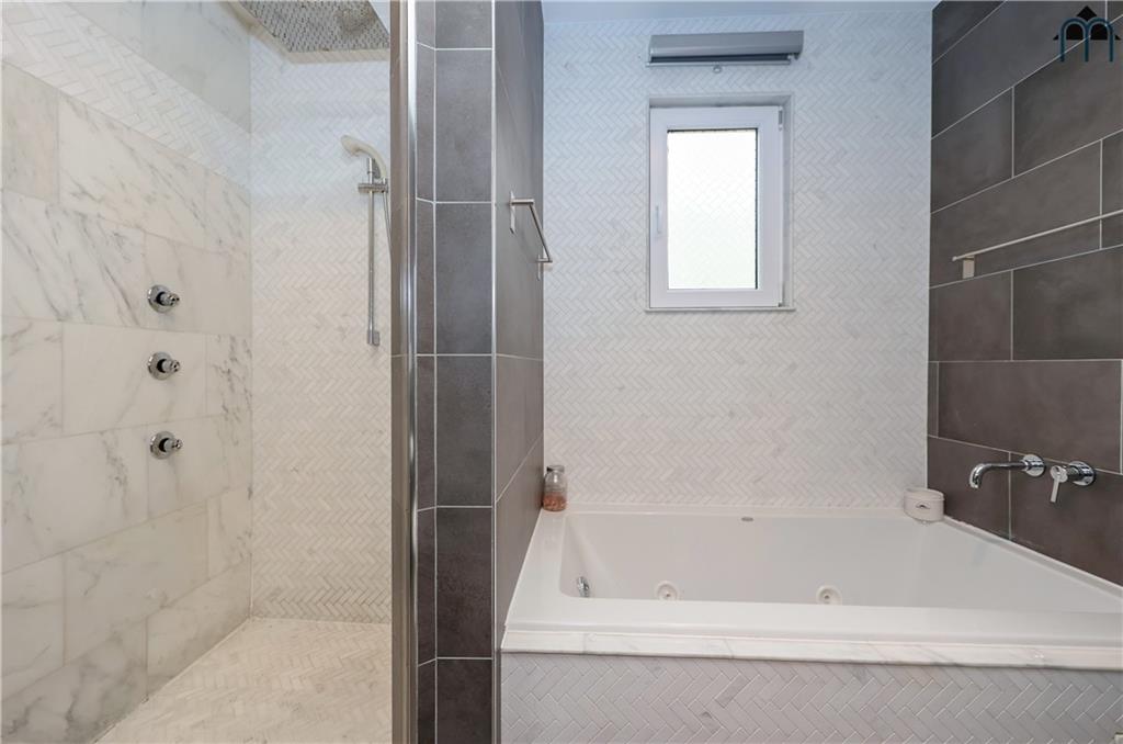 2 Brighton 4th Road Brooklyn, NY 11235 - Photo 17 of 31 a bathroom with a bathtub