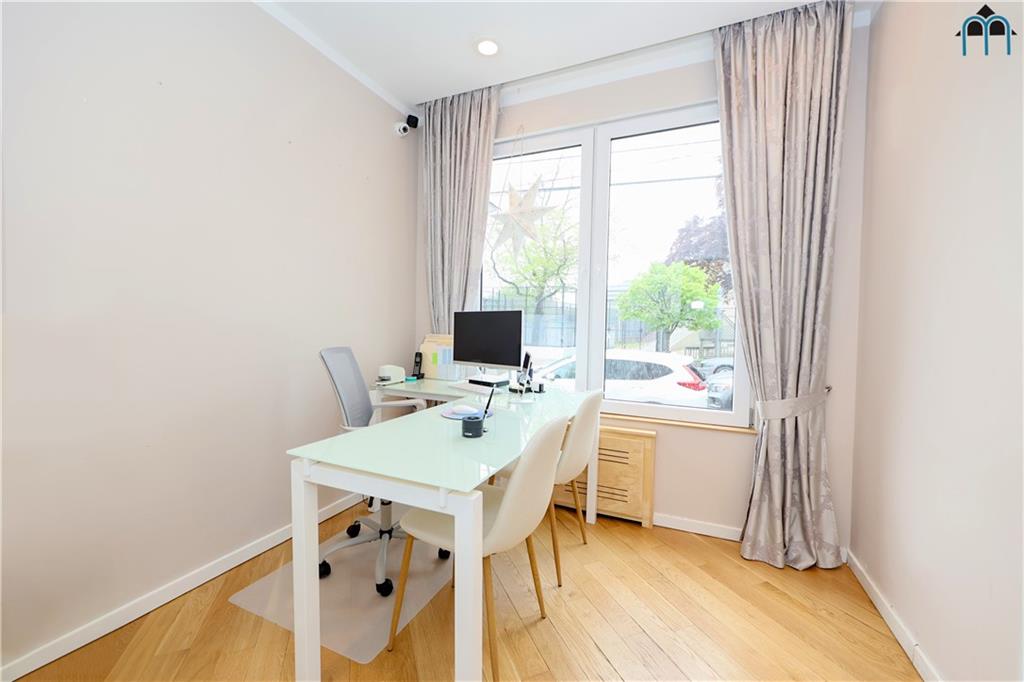 2 Brighton 4th Road Brooklyn, NY 11235 - Photo 19 of 31 a view of a dining room that has a table and chairs in it