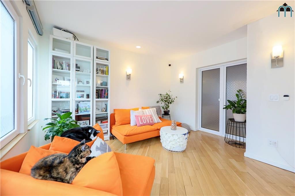 2 Brighton 4th Road Brooklyn, NY 11235 - Photo 3 of 31 a living room with furniture and flowers