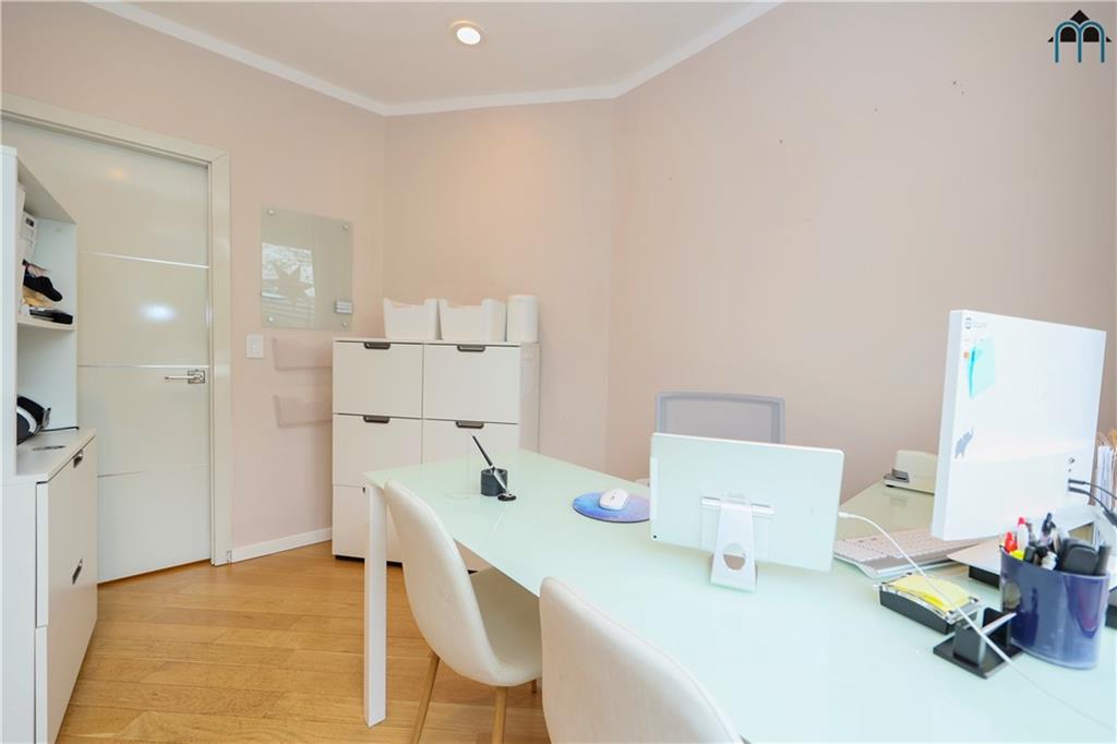 2 Brighton 4th Road Brooklyn, NY 11235 - Photo 21 of 31 a workspace with furniture and a chandelier