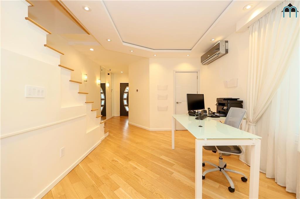 2 Brighton 4th Road Brooklyn, NY 11235 - Photo 22 of 31 a bathroom with a sink a mirror and shower