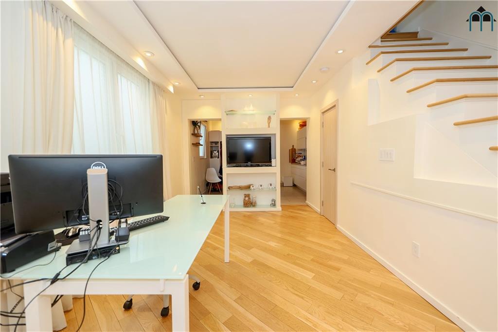 2 Brighton 4th Road Brooklyn, NY 11235 - Photo 24 of 31 a large white kitchen with a large window