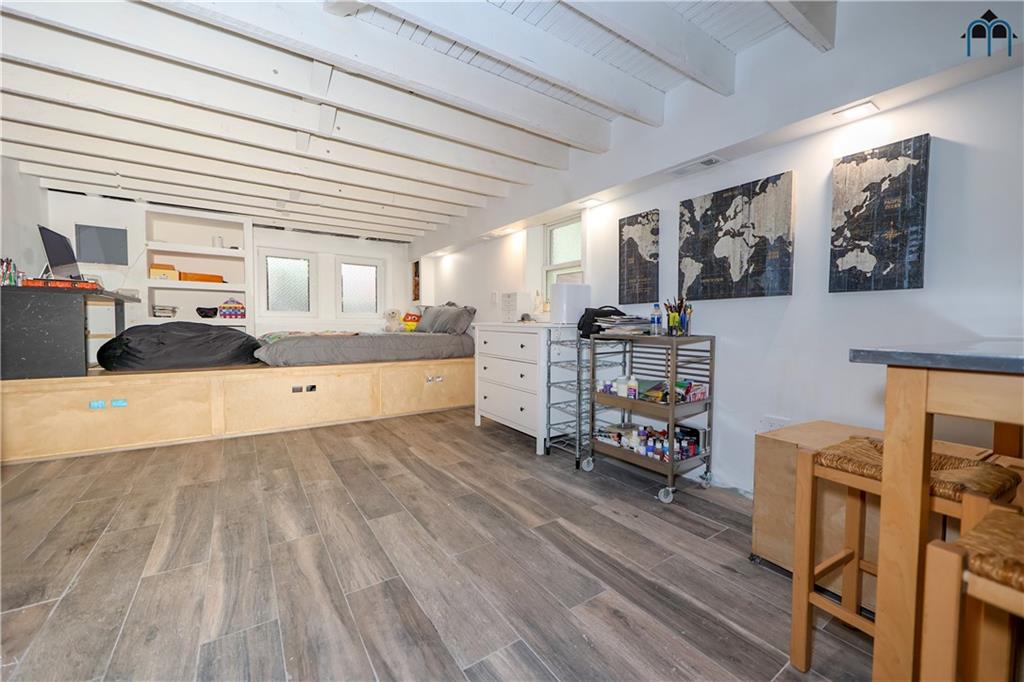 2 Brighton 4th Road Brooklyn, NY 11235 - Photo 27 of 31 a kitchen with furniture and a fireplace