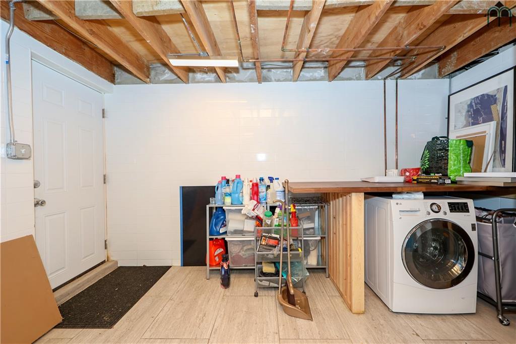 2 Brighton 4th Road Brooklyn, NY 11235 - Photo 29 of 31 a storage room with washer and dryer