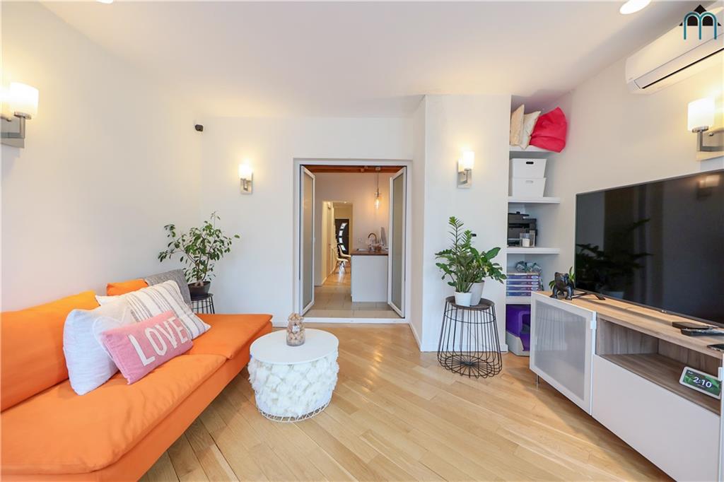 2 Brighton 4th Road Brooklyn, NY 11235 - Photo 4 of 31 a living room with furniture fireplace and flat screen tv
