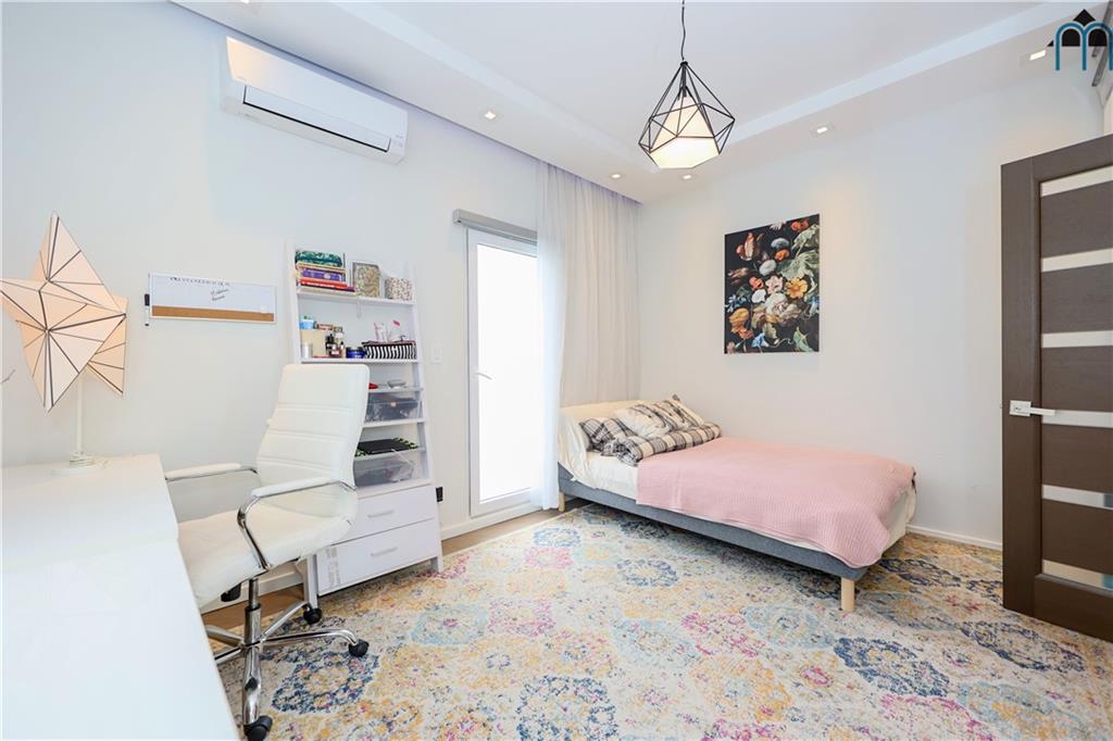 2 Brighton 4th Road Brooklyn, NY 11235 - Photo 6 of 31 a bedroom with a bed and furniture