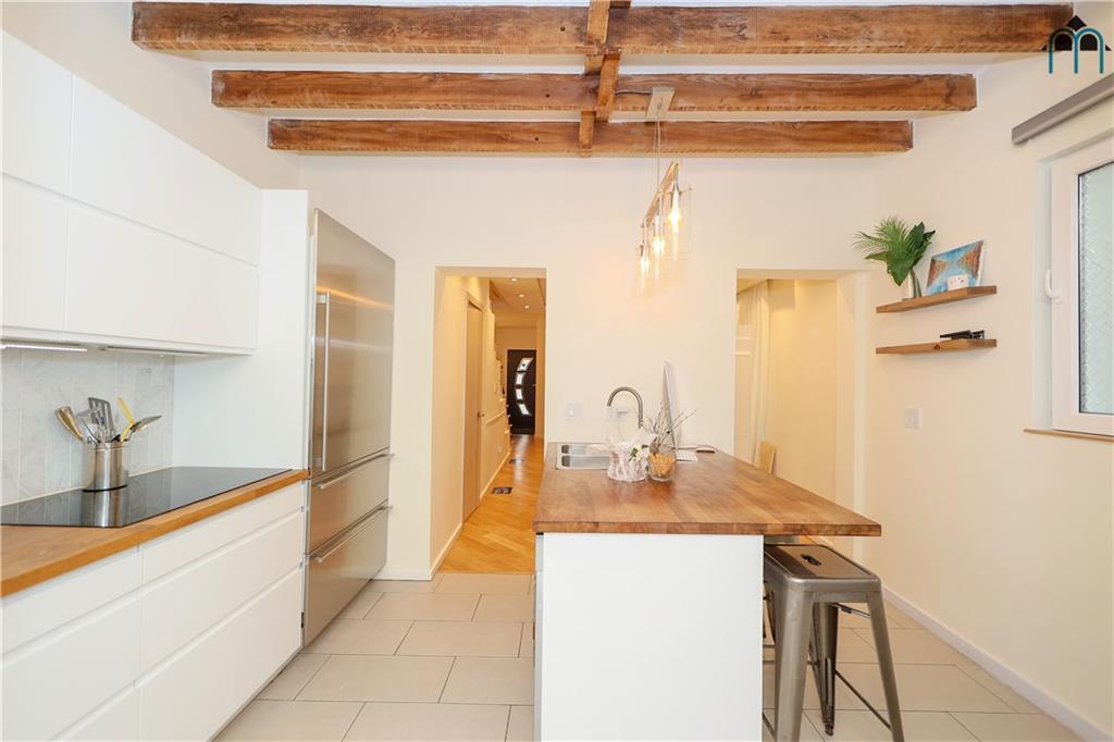 2 Brighton 4th Road Brooklyn, NY 11235 - Photo 9 of 31 a kitchen with a sink and cabinets