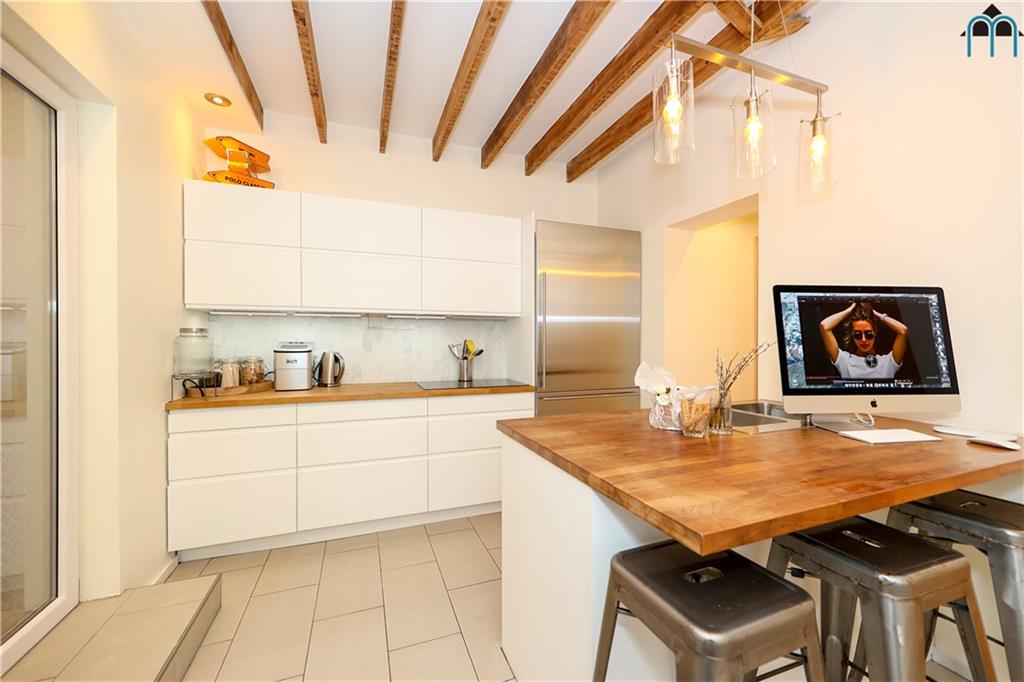 2 Brighton 4th Road Brooklyn, NY 11235 - Photo 10 of 31 a kitchen with stainless steel appliances granite countertop a sink and a stove