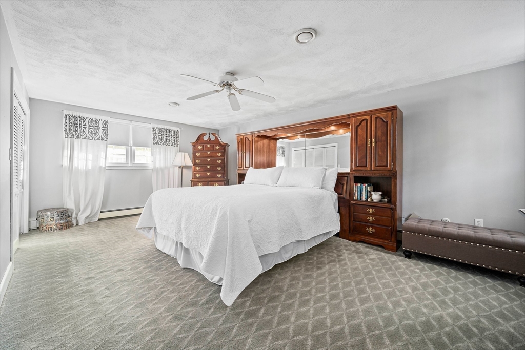 5 Lehan Street Canton, MA 02021 - Photo 14 of 27 a spacious bedroom with a bed and window