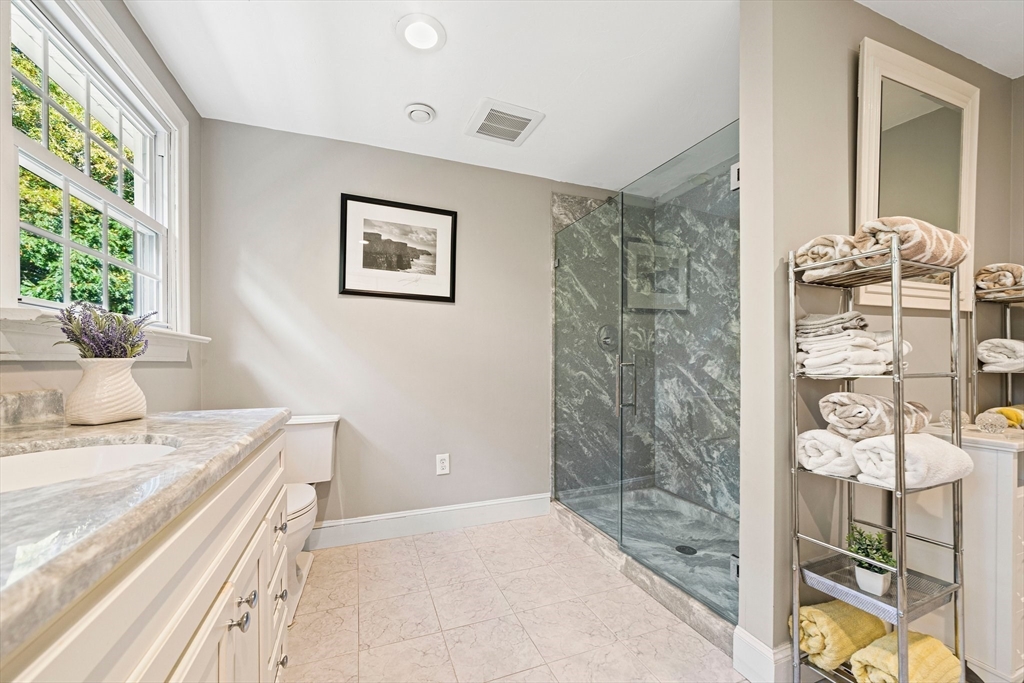 5 Lehan Street Canton, MA 02021 - Photo 17 of 27 a bathroom with a sink and a mirror