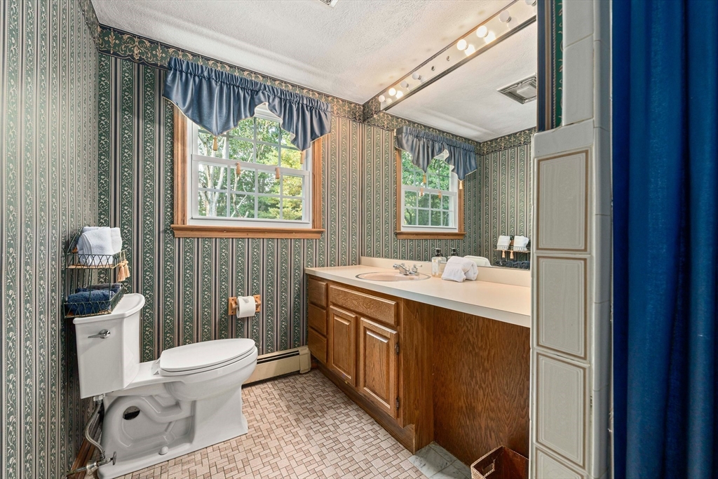 5 Lehan Street Canton, MA 02021 - Photo 22 of 27 a bathroom with a sink toilet and window