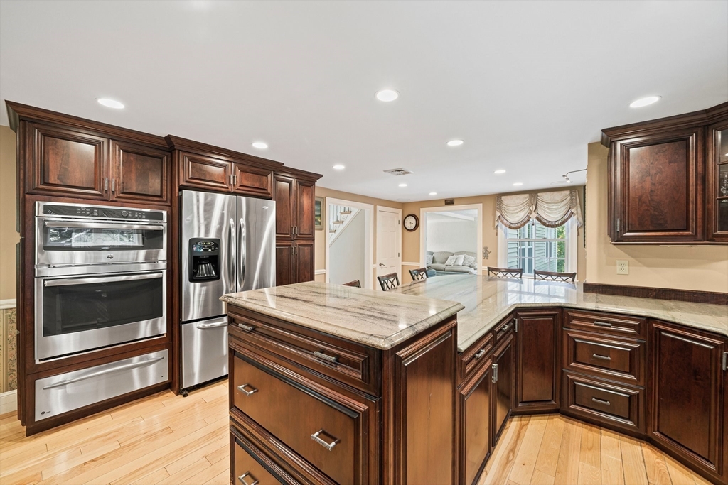 5 Lehan Street Canton, MA 02021 - Photo 9 of 27 a kitchen with a sink stove and refrigerator