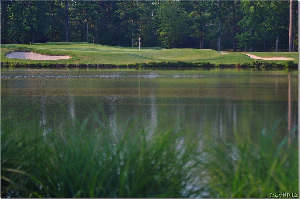 1245 Two Rivers Point Williamsburg, VA 23185 - Photo 7 of 25 a view of a water pond with green yard