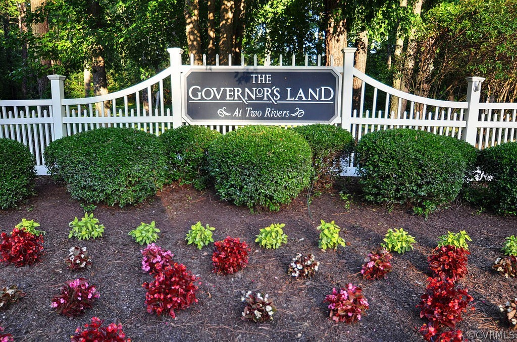 1245 Two Rivers Point Williamsburg, VA 23185 - Photo 10 of 25 a view of a sign board in front of flowers