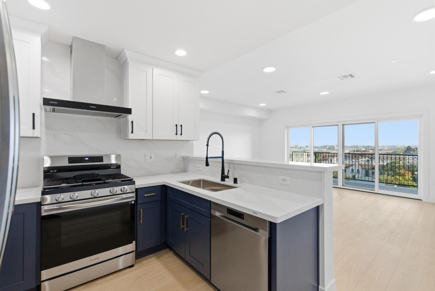 560 El Camino Real, Unit 406 San Carlos, CA 94070 - Photo 13 of 48 a kitchen with a sink stove top oven and cabinets