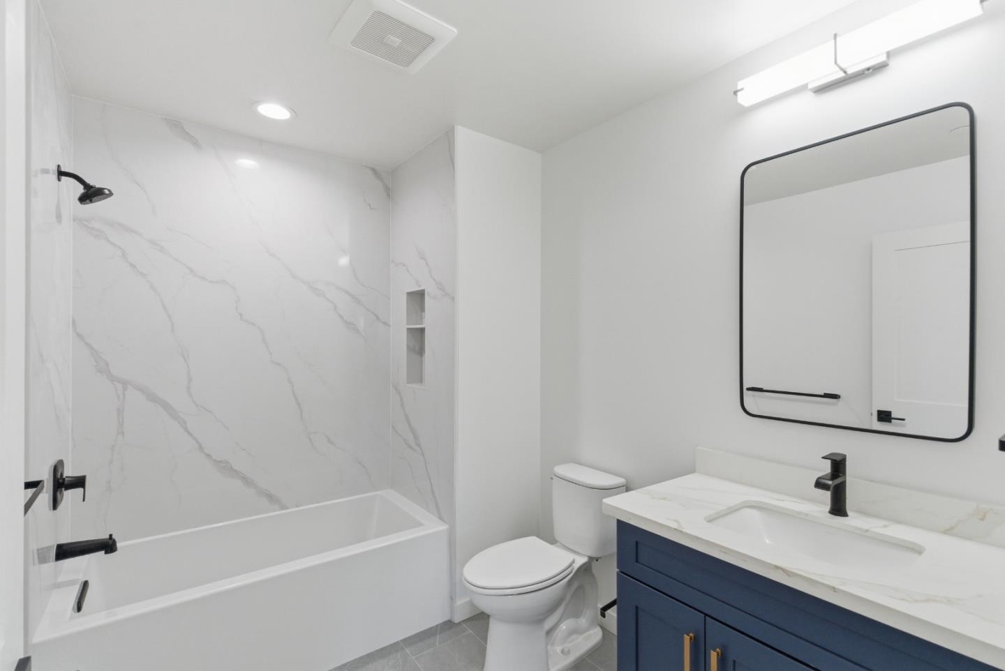 560 El Camino Real, Unit 406 San Carlos, CA 94070 - Photo 22 of 48 a bathroom with a sink a toilet and a mirror