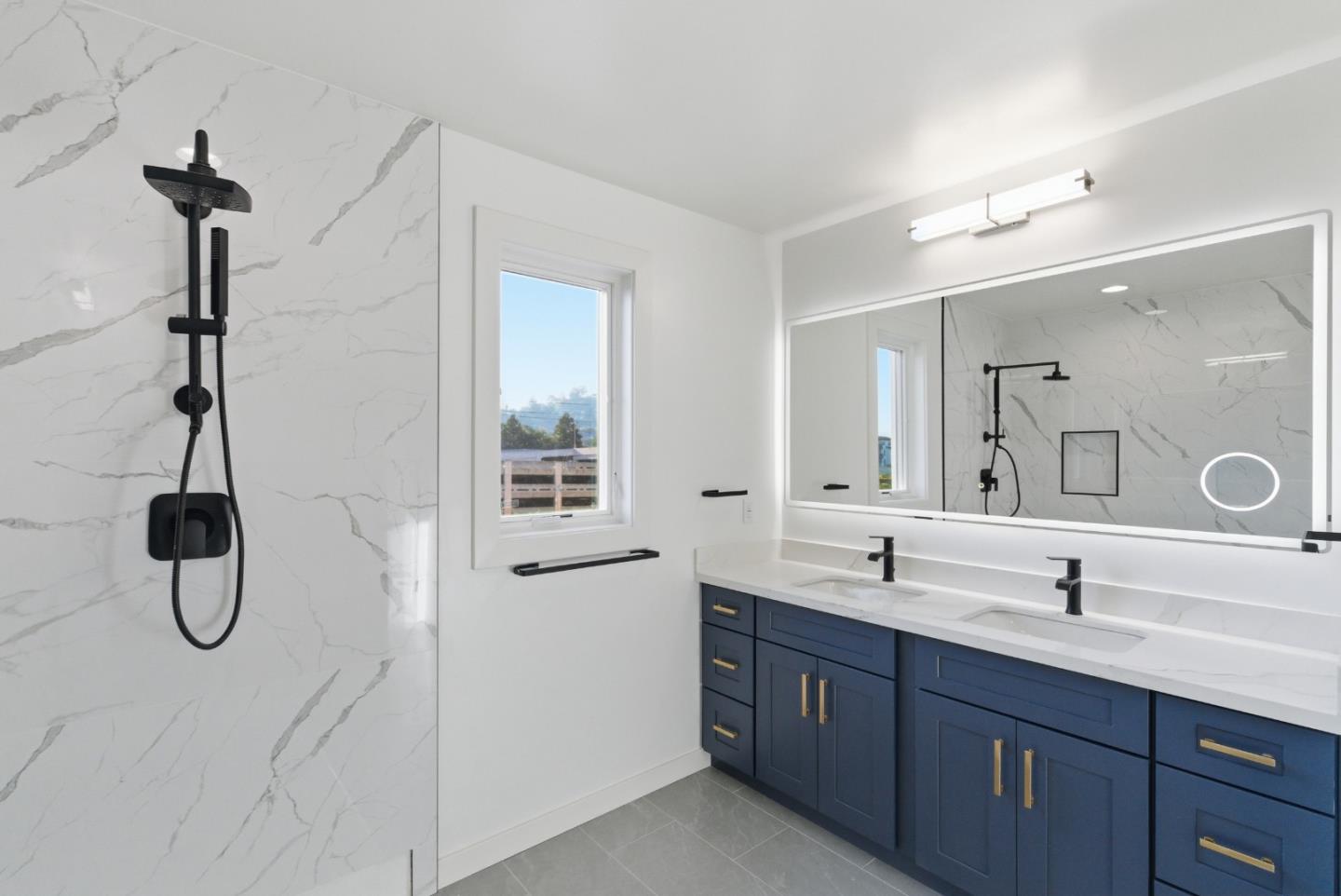 560 El Camino Real, Unit 406 San Carlos, CA 94070 - Photo 29 of 48 a bathroom with a double vanity sink a toilet a window and mirror