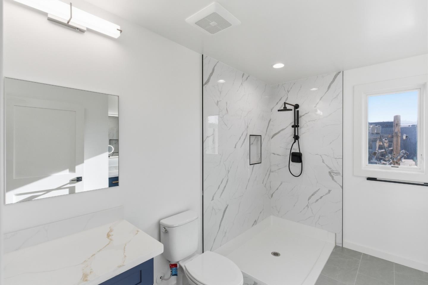 560 El Camino Real, Unit 406 San Carlos, CA 94070 - Photo 30 of 48 a bathroom with a bathtub shower sink and toilet