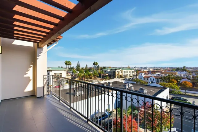 a view of a balcony with furniture