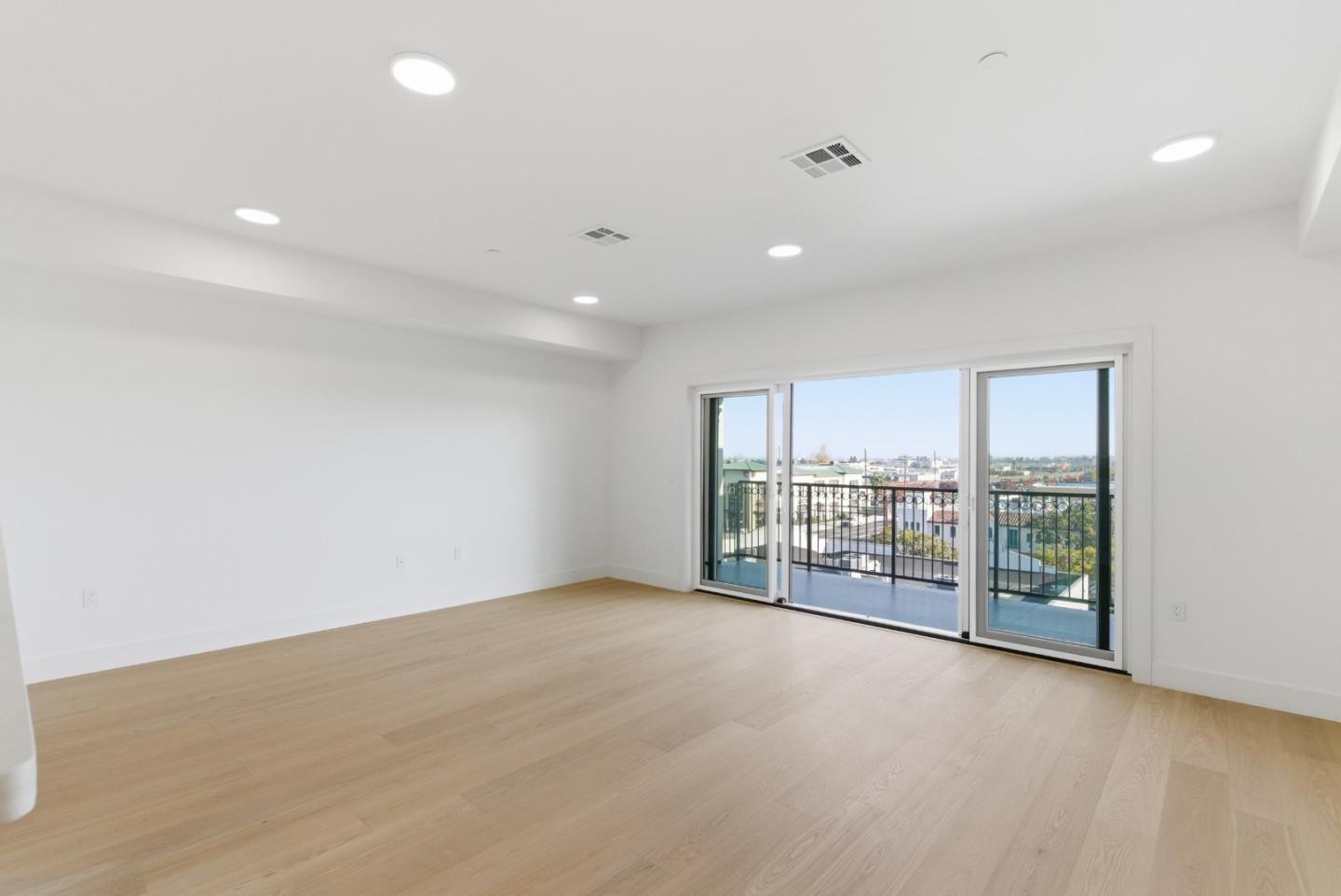 560 El Camino Real, Unit 406 San Carlos, CA 94070 - Photo 35 of 48 an empty room with floor to ceiling window and an outdoor view