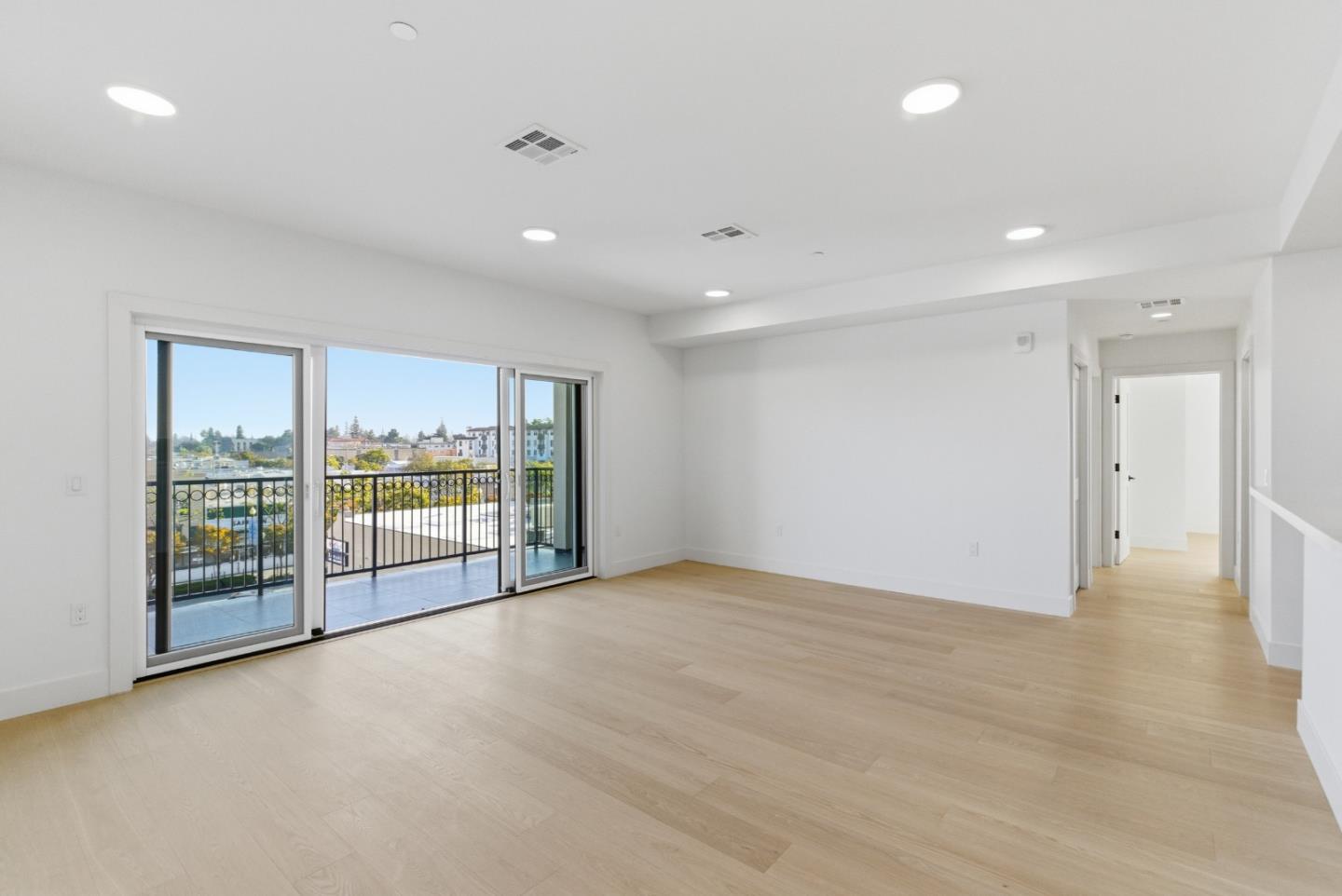 560 El Camino Real, Unit 406 San Carlos, CA 94070 - Photo 37 of 48 a view of an empty room with glass door and chandelier