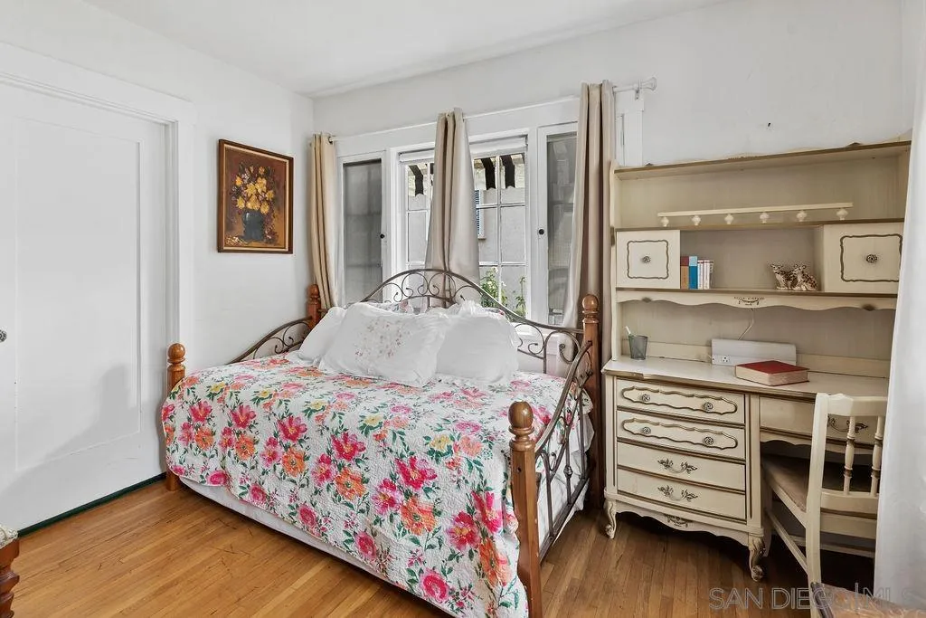 4531 Date Avenue La Mesa, CA 91941 - Photo 19 of 34 a bedroom with a bed and wooden floor