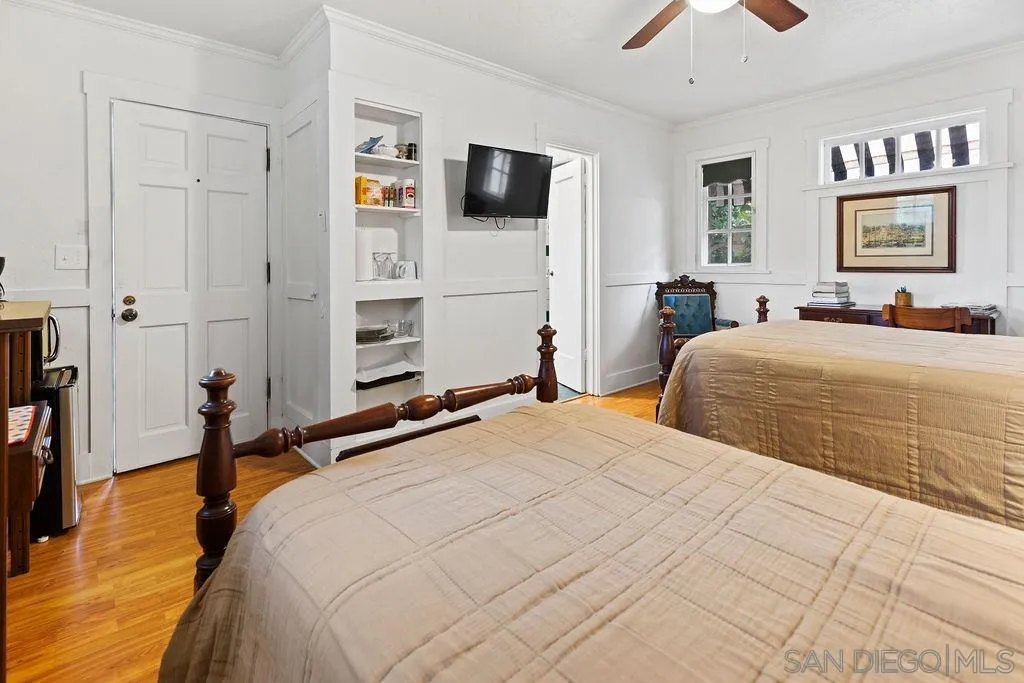 4531 Date Avenue La Mesa, CA 91941 - Photo 23 of 34 a bedroom with a bed and a flat screen tv