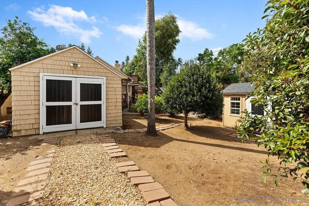 4531 Date Avenue La Mesa, CA 91941 - Photo 27 of 34 a view of a house with a yard and large tree