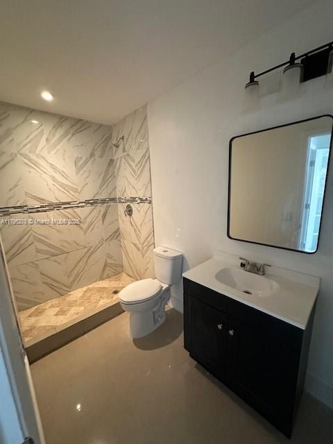 5209 Northwest 18th Street, Unit 3E Lauderhill, FL 33313 - Photo 8 of 8 a bathroom with a double vanity sink toilet and mirror