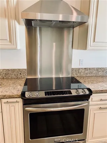 a utility room with sink dryer and washer