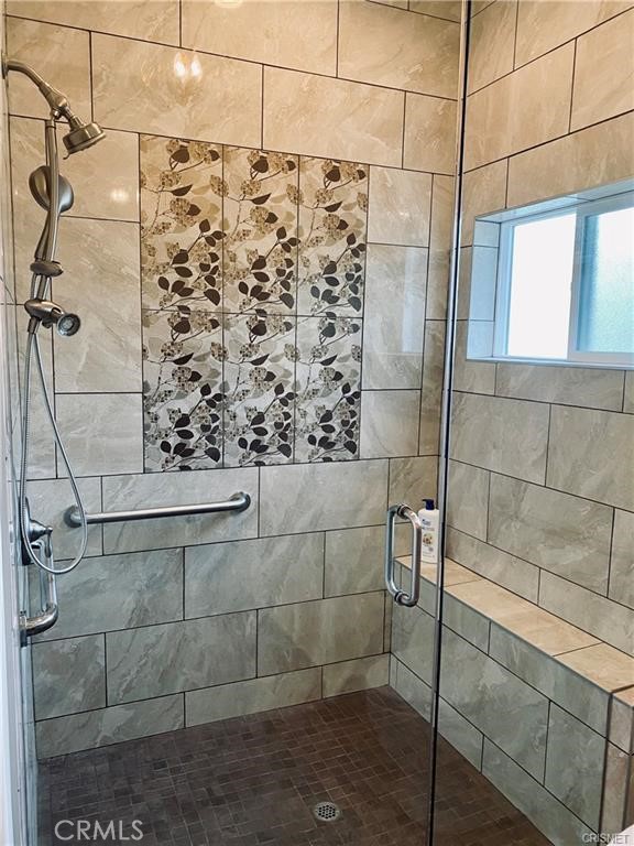 19238 Arminta Street Reseda, CA 91335 - Photo 17 of 61 a bathroom with a shower