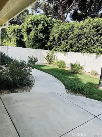 a kitchen with granite countertop a sink stainless steel appliances and cabinets