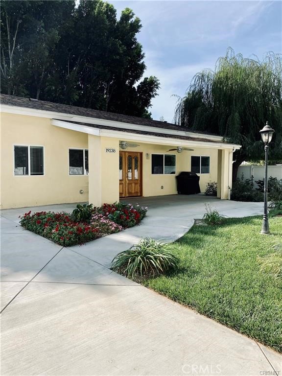 19238 Arminta Street Reseda, CA 91335 - Photo 23 of 61 a view of a house with backyard and garden