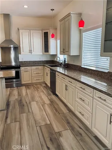 a kitchen with a stove and cabinets