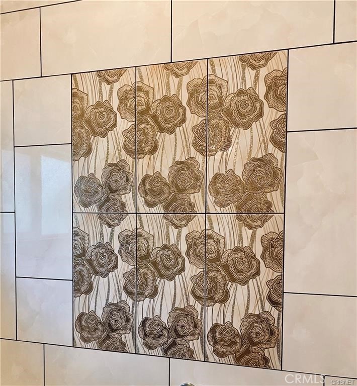 19238 Arminta Street Reseda, CA 91335 - Photo 27 of 61 a white painted wall with a painting on it