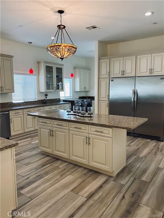 19238 Arminta Street Reseda, CA 91335 - Photo 33 of 61 a kitchen with stainless steel appliances granite countertop a sink a stove and a refrigerator