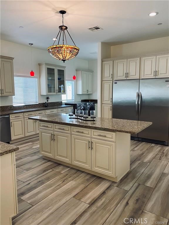 19238 Arminta Street Reseda, CA 91335 - Photo 36 of 61 a kitchen with stainless steel appliances granite countertop a sink a stove and a refrigerator