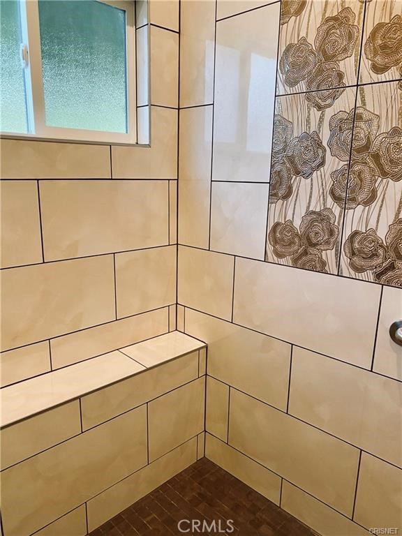 19238 Arminta Street Reseda, CA 91335 - Photo 45 of 61 a bathroom with a shower