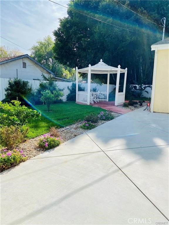 19238 Arminta Street Reseda, CA 91335 - Photo 56 of 61 a front view of house with yard and green space