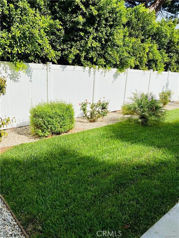 19238 Arminta Street Reseda, CA 91335 - Photo 58 of 61 a backyard of a house with lots of green space