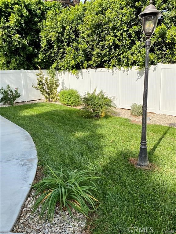 19238 Arminta Street Reseda, CA 91335 - Photo 59 of 61 a view of a garden with a tree