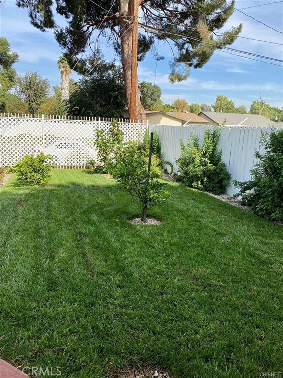19238 Arminta Street Reseda, CA 91335 - Photo 60 of 61 a view of a lake from a yard