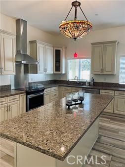 19238 Arminta Street Reseda, CA 91335 - Photo 10 of 61 a kitchen with stainless steel appliances granite countertop a sink a counter top space cabinets and window
