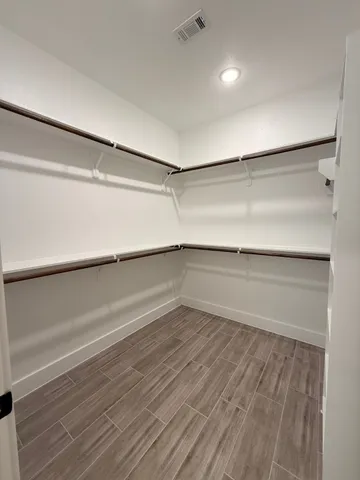 a view of an empty walk in closet
