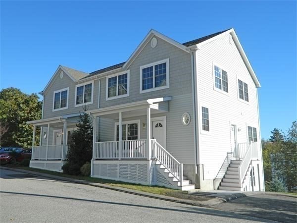 a front view of a house with a garage